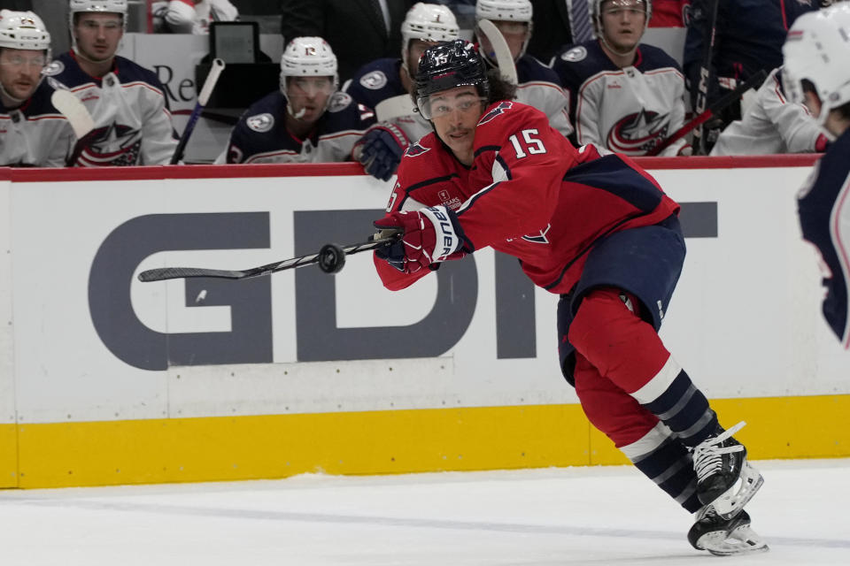 Washington Capitals left wing Sonny Milano (15) deflects the puck during the first period of an NHL hockey game against the Columbus Blue Jackets in Washington, Saturday, Nov. 18, 2023. The Capitals beat the Blue Jackets, 4-3. (AP Photo/Susan Walsh)