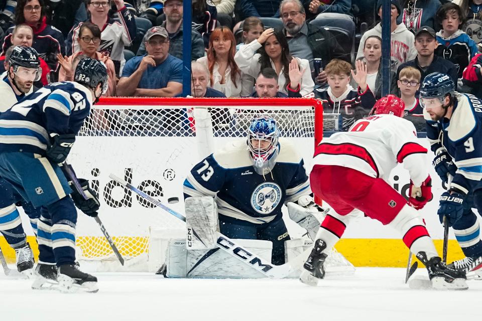 Apr 16, 2024; Columbus, Ohio, USA; Columbus Blue Jackets goaltender Jet Greaves (73) saves a shot in front of Carolina Hurricanes center Jack Drury (18) during the third period of the NHL hockey game at Nationwide Arena.
