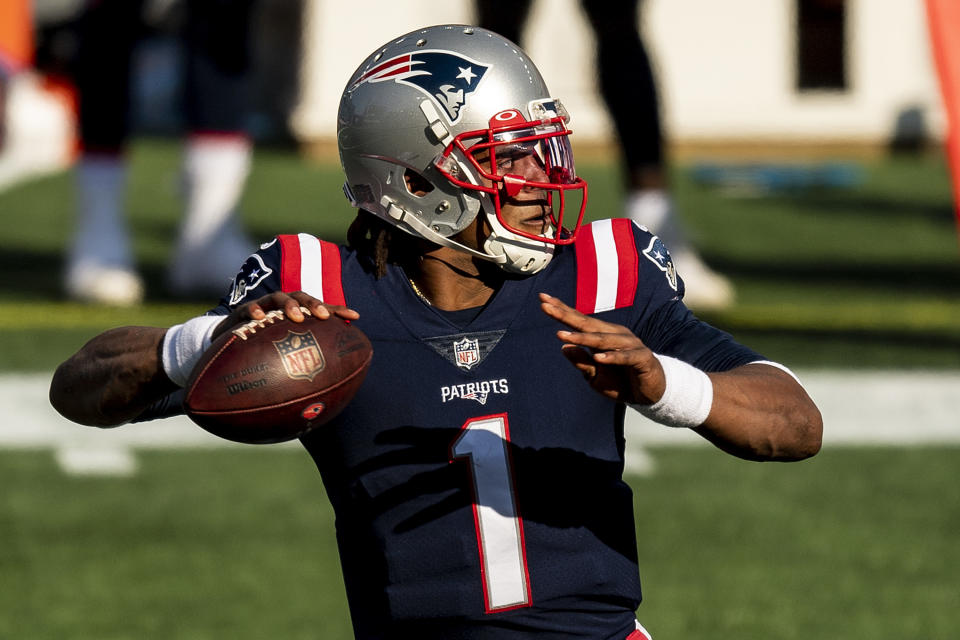 Patriots uniforms, silver helmets, blue jerseys, and white lettering