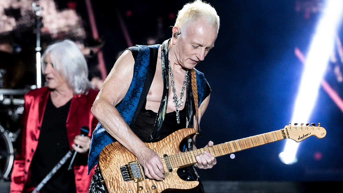  Phil Collen plays live onstage with his signature Jackson Soloist. 