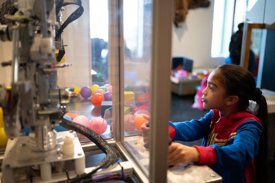 A robotics exhibit gives kids a chance to maneuver a mechanical arm at the Spartanburg Science Center in the Chapman Cultural Center