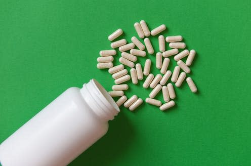 <span class="caption">Choosing the right probiotic strain is also important. </span> <span class="attribution"><a class="link " href="https://www.shutterstock.com/image-photo/white-medicine-capsules-pill-bottle-on-1076904332" rel="nofollow noopener" target="_blank" data-ylk="slk:Vinogradskaya Natalia/ Shutterstock;elm:context_link;itc:0;sec:content-canvas">Vinogradskaya Natalia/ Shutterstock</a></span>