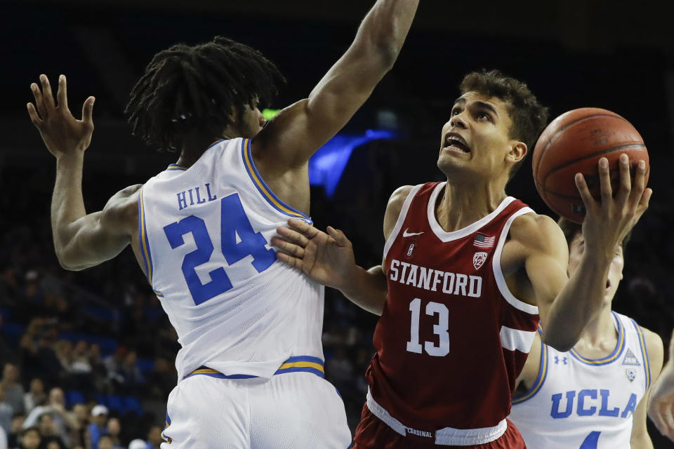Stanford forward Oscar da Silva shoots around UCLA forward Jalen Hill during the first half of an NCAA college basketball game in Los Angeles, Wednesday, Jan. 15, 2020. (AP Photo/Chris Carlson)