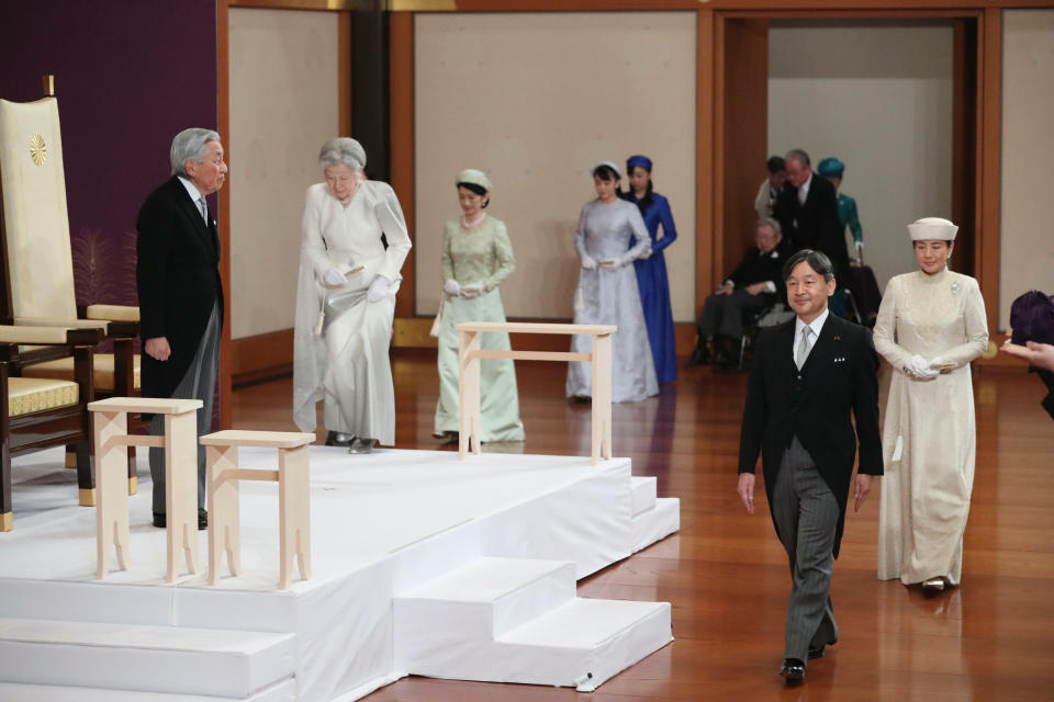Japan's Emperor Akihito, left, with Empress Michiko, second from left, and his son Crown Prince Naruhito, second from right, and Crown Princess Masako, right, arrives for the ceremony of his abdication at the Imperial Palace in Tokyo, Tuesday, April 30, 2019. Akihito announced his abdication at a palace ceremony Tuesday in his final address, as the nation embraced the end of his reign with reminiscence and hope for a new era. (Japan Pool via AP)