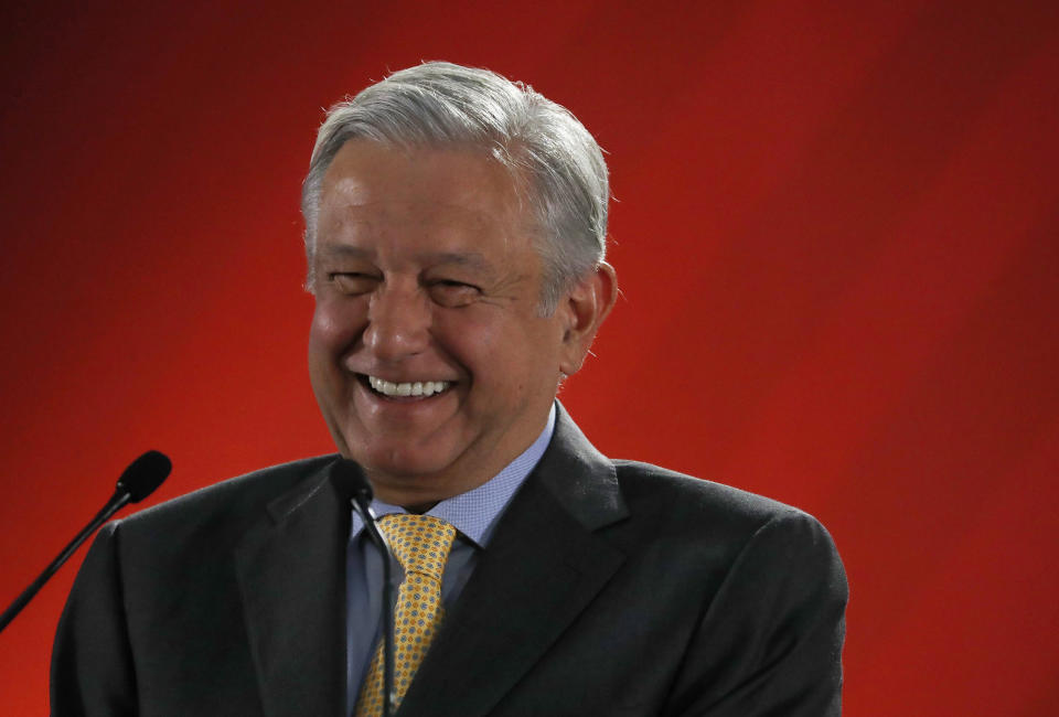 In this Friday, March 8, 2019 photo, Mexican President Andres Manuel Lopez Obrador talks to journalists at his daily 7 a.m. press conference at the National Palace in Mexico City. Lopez Obrador's first 100 days in office have combined a compulsive shedding of presidential trappings with a dizzying array of policy initiatives, and a series of missteps haven't even dented his soaring approval ratings. (AP Photo/Marco Ugarte)
