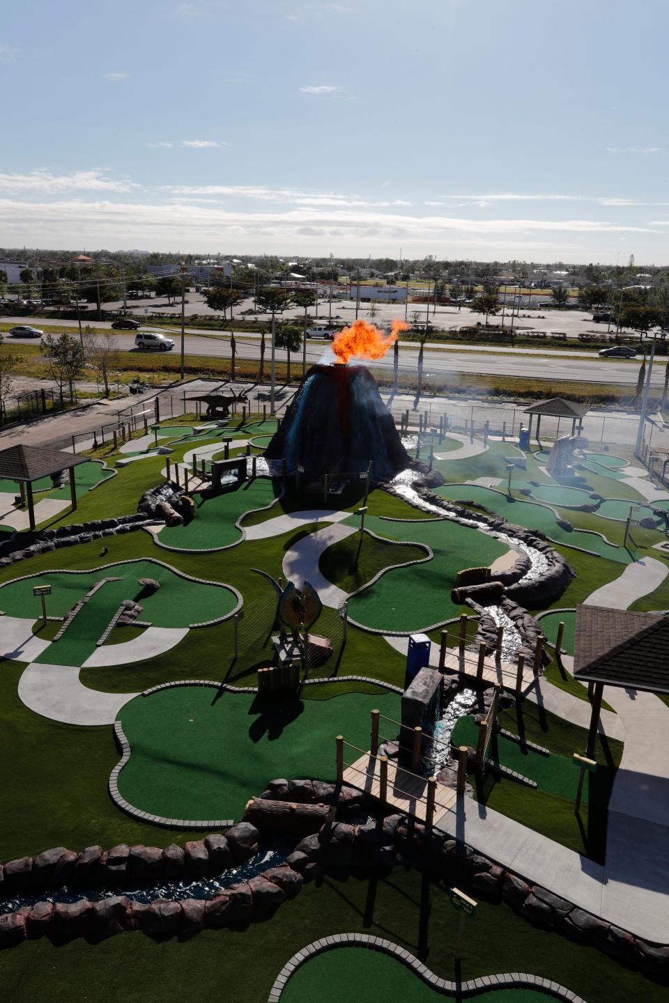 Cape Coral's Gator Mike's Family Fun Park opened Dinosaur Falls Mini Golf, an Orlando-style tourist attraction, on Dec. 29, 2022. It features 19 holes of golf; nine moving, roaring animatronic dinosaurs; three waterfalls; and a 30-foot "volcano" spewing fireballs into the sky.