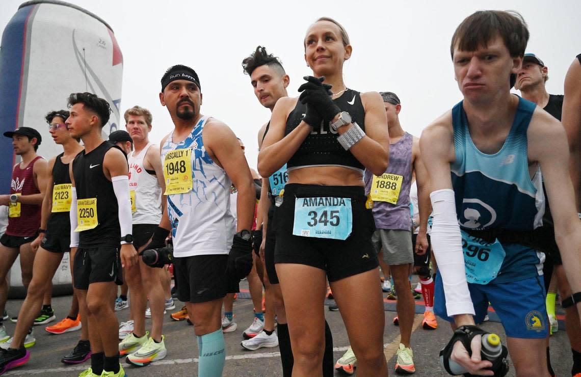 Runners for the Full Marathon and the Half Marathon stand at the starting line for the annual Two Cities Marathon on Sunday, Nov. 6, 2022, in Clovis.