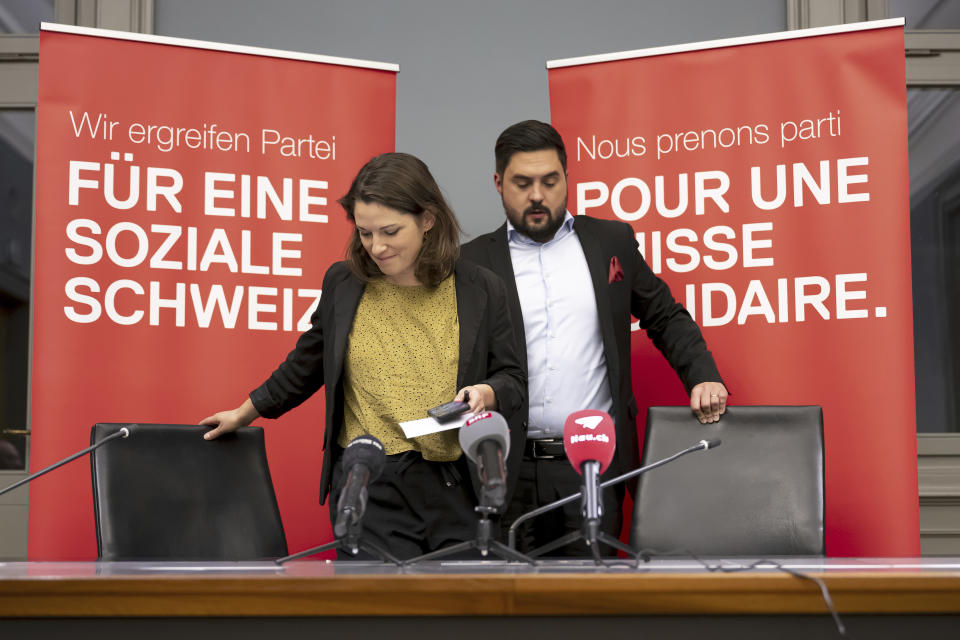 Mattea Meyer, Co-President of the Swiss Social Democratic Party SP, left, and Cedric Wermuth, Co-President of the SP, right, arrive to give a press conference in the Parliament building in Bern, Switzerland, Sunday, Oct. 22, 2023. Official results in Switzerland election show that the anti-immigration Swiss People’s Party has rebounded from searing losses four years ago to expand its hold as the largest parliamentary faction. The Socialists were in second and they added two seats to reach 41 in the lower chamber. (Anthony Anex/Keystone via AP)