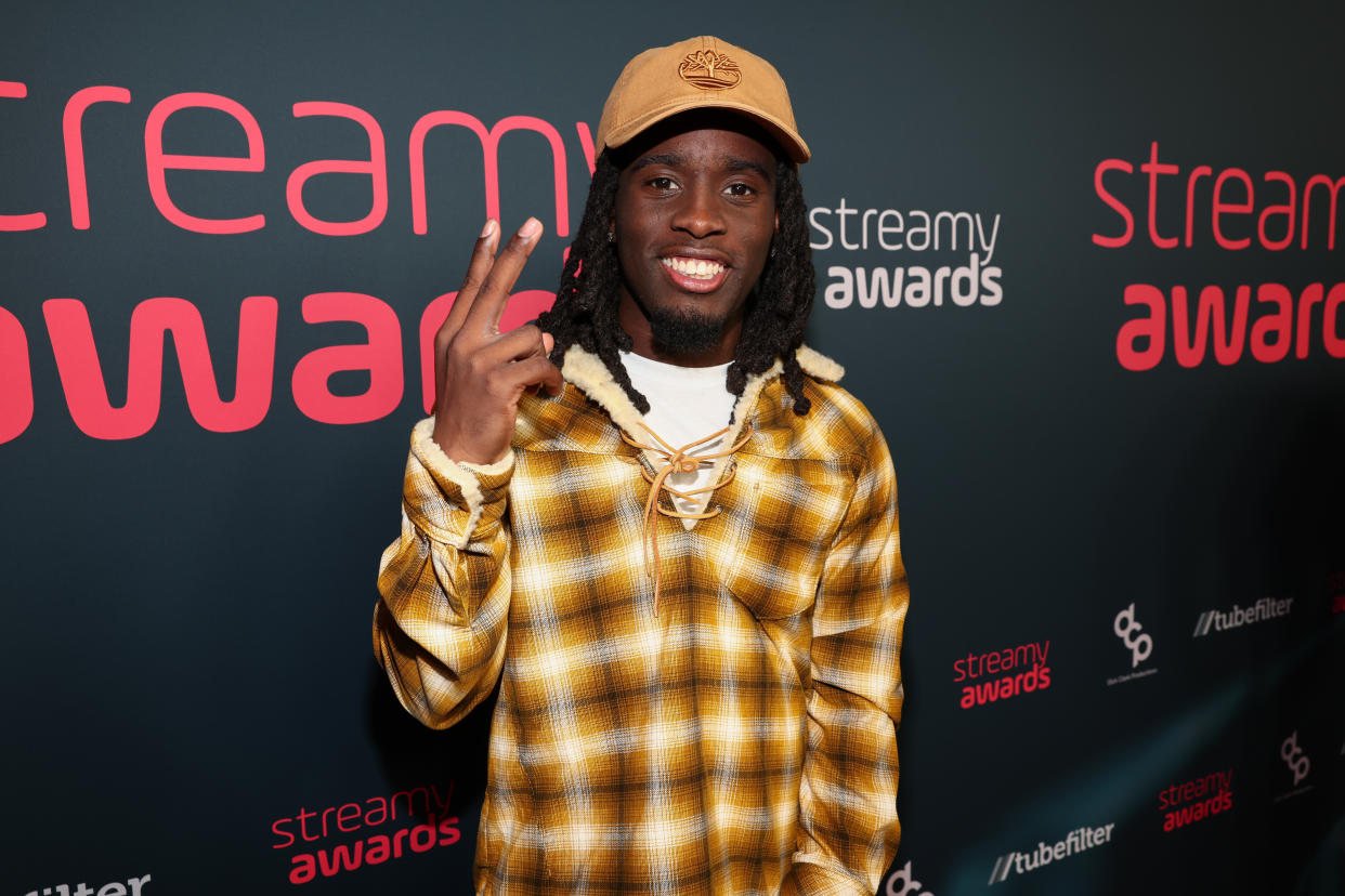 Kai Cenat poses for the camera at the Streamy Awards.