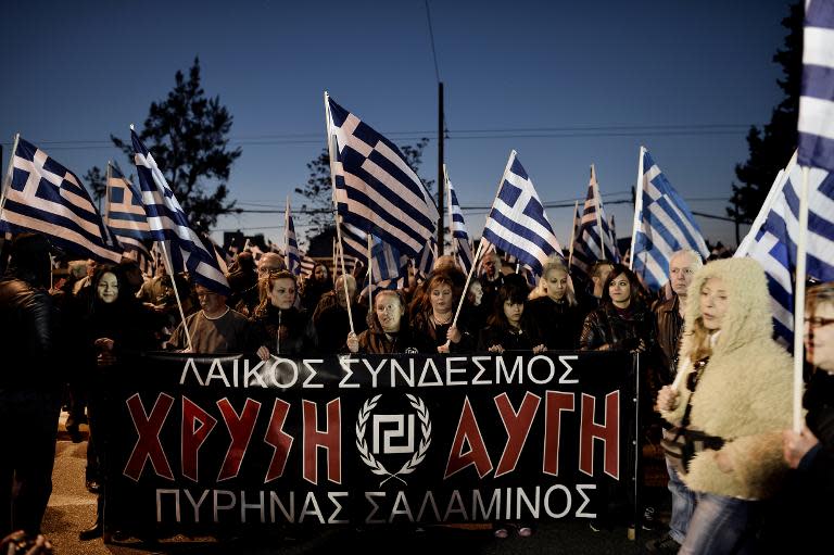 Supporters of the ultra-nationalist Golden Dawn party demonstrate in support of the exile of illegal immigrants on World Day against Racism and Fascism in Athens on March 21, 2015