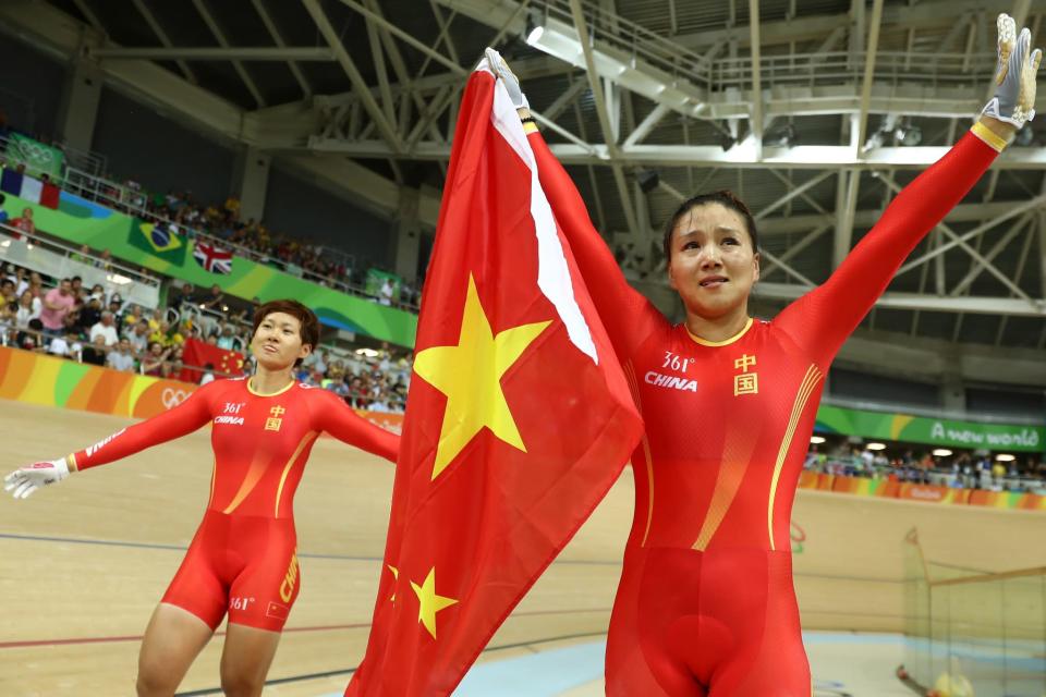 <p>Jinjie Gong (R) and Tianshi Zhong (L) of Team China celebrates winning the gold medal after beating Team Russia in the Women’s Team Sprint final for gold on Day 7 of the Rio 2016 Olympic Games at the Rio Olympic Velodrome on August 12, 2016 in Rio de Janeiro, Brazil. (Photo by Bryn Lennon/Getty Images) </p>