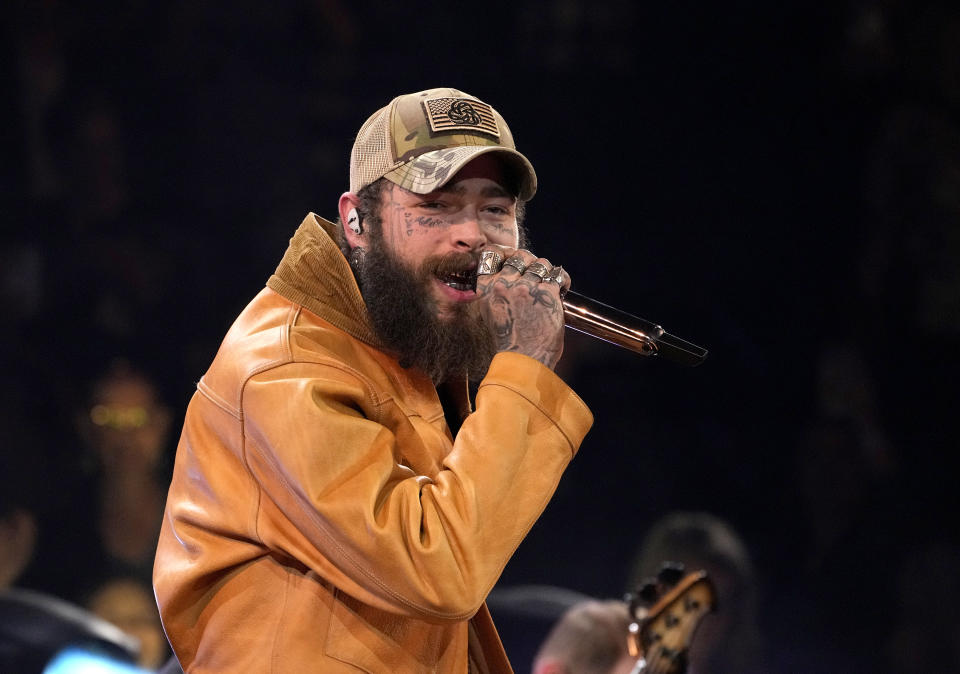 FILE - Post Malone performs a medley at the 57th Annual CMA Awards on Wednesday, Nov. 8, 2023, in Nashville, Tenn. Post Malone will perform “America the Beautiful” at the Super Bowl. (AP Photo/George Walker IV, File)