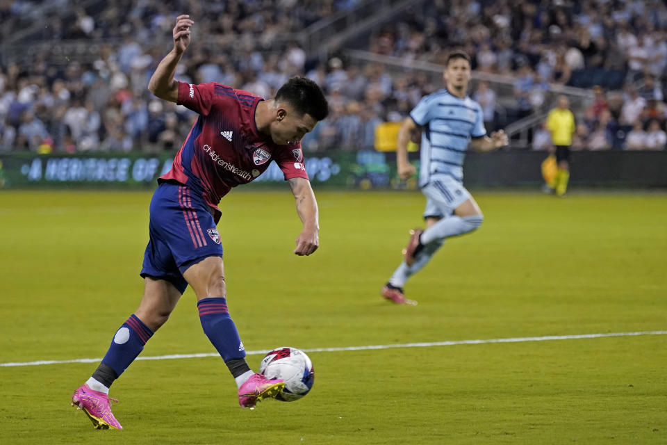 FC Dallas forward Alan Velasco kicks the ball during the first half of the team's MLS soccer match against Sporting Kansas City on Wednesday, May 31, 2023, in Kansas City, Kan. (AP Photo/Charlie Riedel)