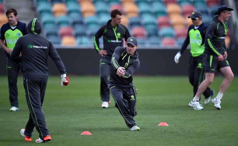 Ireland captain William Porterfield (C) takes a catch during a training session at the Bellerive Oval ground ahead of the 2015 Cricket World Cup Pool B match between Ireland and Zimbabwe in Hobart on March 6, 2015