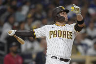 San Diego Padres' Victor Caratini (17) hits a solo home run during the seventh inning of a baseball game against the Los Angeles Dodgers Wednesday, June 23, 2021, in San Diego. (AP Photo/Denis Poroy)