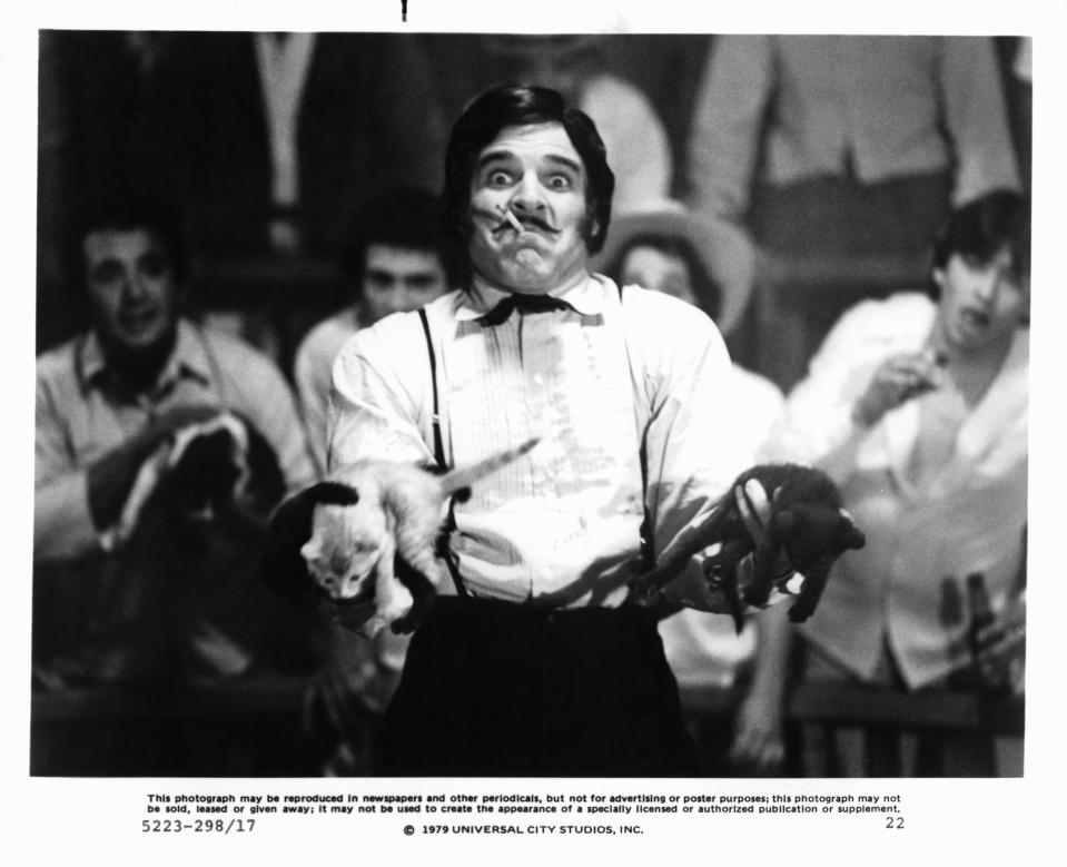 Steve Martin juggling cats in a scene from the film 'The Jerk', 1979. (Photo by Universal Pictures/Getty Images)