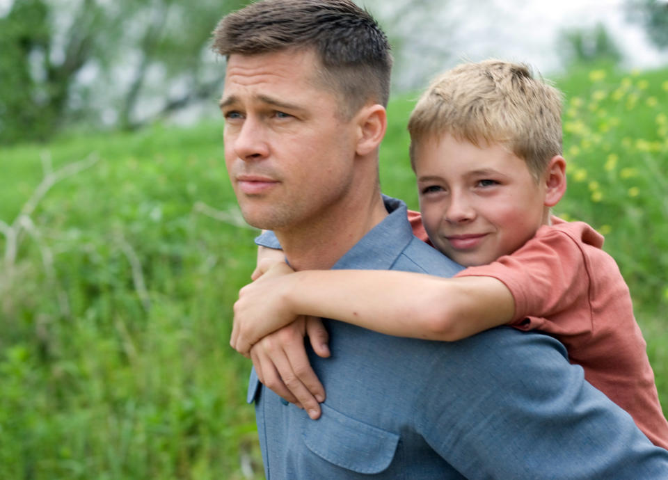 Brad Pitt's character holding his son