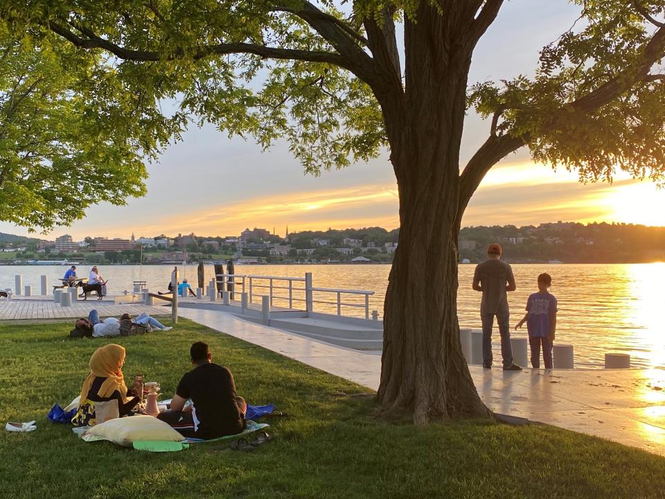 Golden light reflects off the Hudson River at Beacon Point at Long Dock Park in Beacon, N.Y.