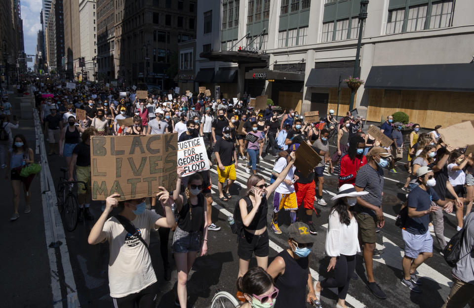 Activists move along Seventh Avenue, Saturday, June 6, 2020, in New York, during a protest over the death of George Floyd, who died May 25 after being restrained by police in Minneapolis. (AP Photo/Craig Ruttle)