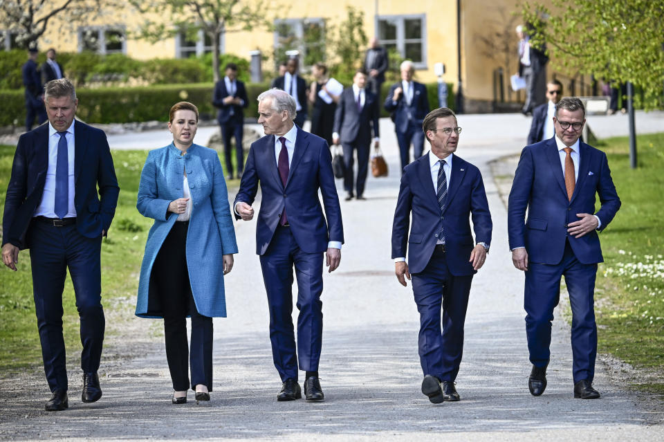 Sweden's Prime Minister Ulf Kristersson, second from right, welcomes the prime ministers of the Nordic countries, from left, Iceland's Bjarni Benediktsson, Denmark's Mette Frederiksen, Norway's Jonas Gahr Støre and Finland's Petteri Orpo, at Skeppsholmen in Stockholm, Sweden, Monday, May 13, 2024, ahead of a two-day Nordic Prime Minister's meeting, on security and competitiveness. (Pontus Lundahl/TT News Agency via AP)