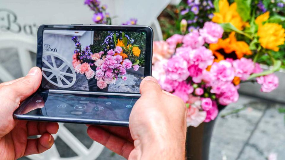 Google Pixel Fold shown in hand