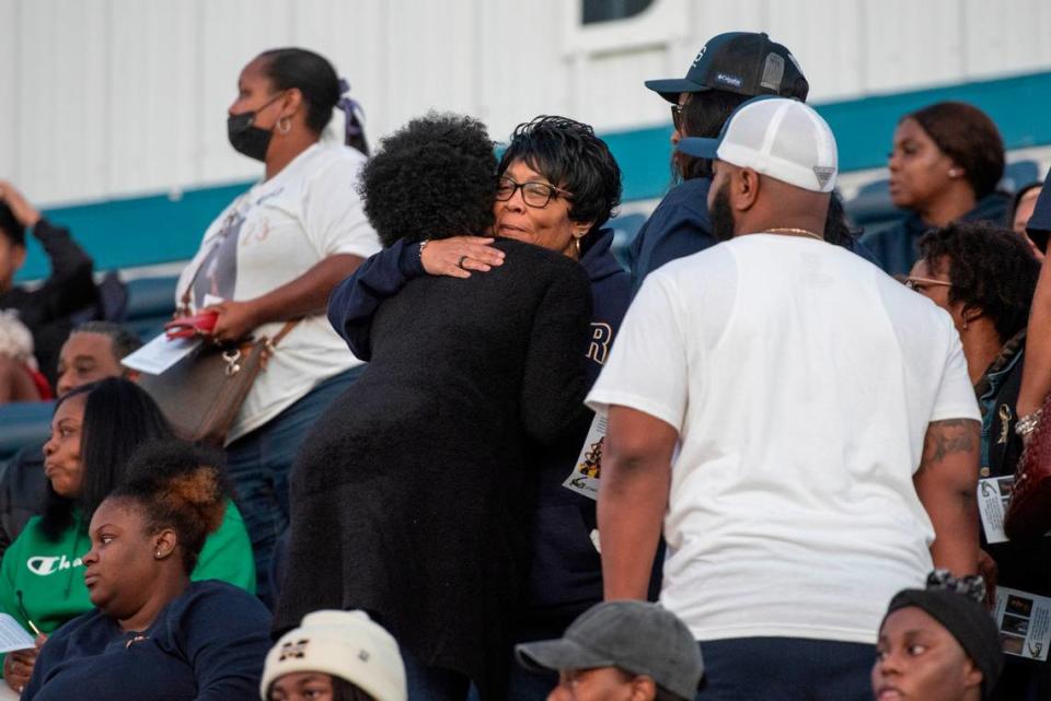 Kyla Watkins’ grandmother, Carole Robinson, hugs family members as family, friends and community members arrive for a candlelight vigil in honor of three Gautier High School graduates at Gautier High School in Gautier on Thursday, Dec. 7, 2023. Se’Dhari Saniya Watson-Person, Kyla “Muffin” Watkins, and Tatyanna Richmond were involved in a fatal crash on Tuesday, leading to the deaths of Watson-Person and Watkins.