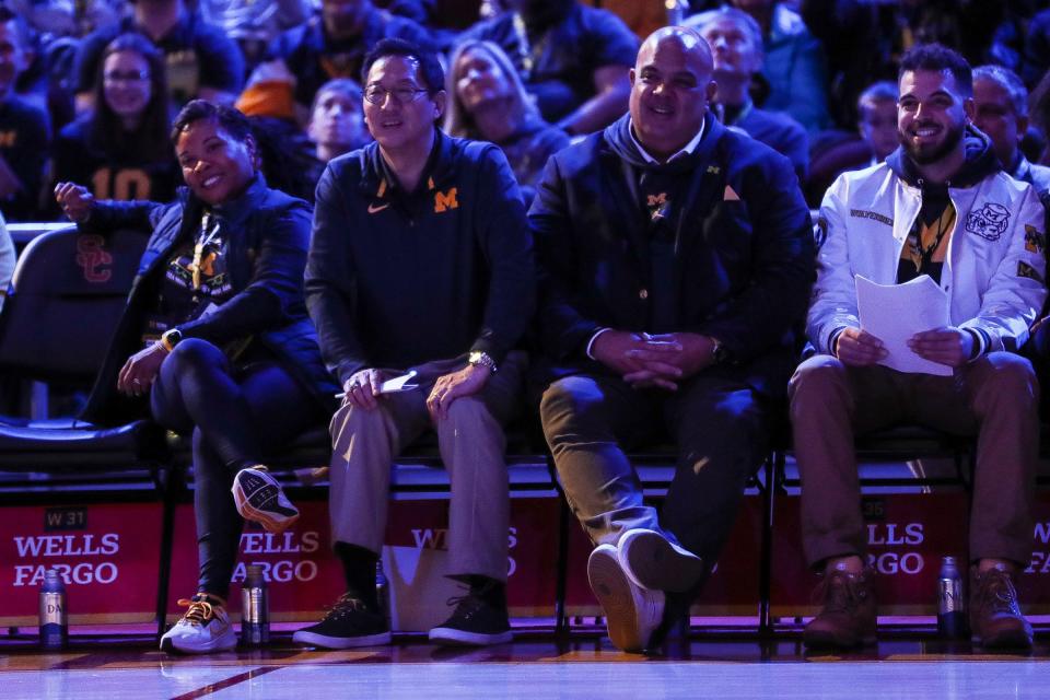 From left, U-M Alumni Association president and CEO Ayanna McConnell, president Santa Ono and athletic director Ward Manuel watch a performance by David Alan Grier during the Alumni Territory Rose Bowl Pep Rally at USC's Galen Center in Los Angeles, Calif. on Sunday, Dec. 31, 2023.