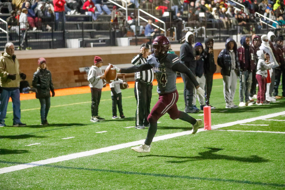 Benedictine's Na'Seir Samuel slips into the end zone for a touchdown during Friday night's state playoff game against Spalding at Memorial Stadium.