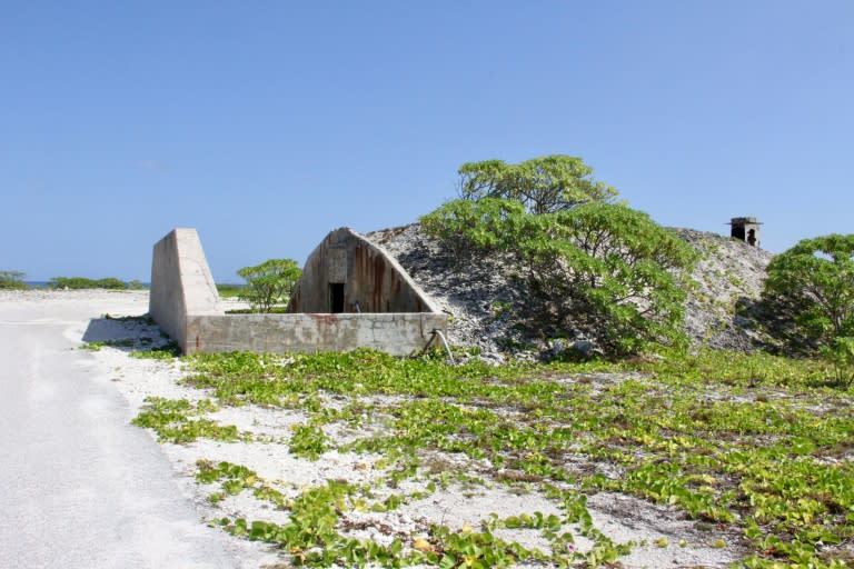 A World War II-era bunker is seen by a beach on Wake Island