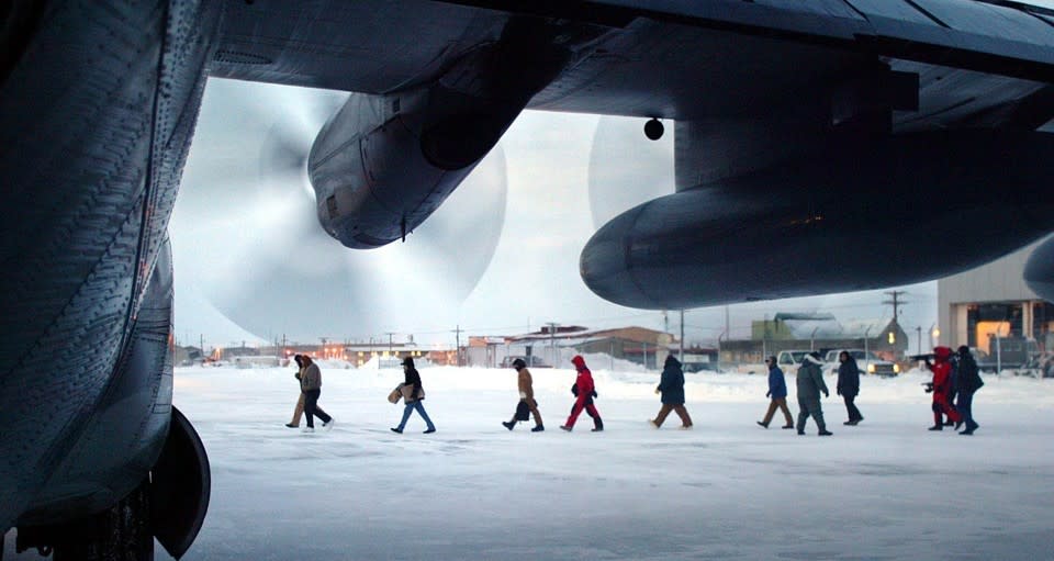 Men in Utqiaġvik, Alaska, prepare to head to work in the oil and gas industry in 2005. (Al Grillo / AP)