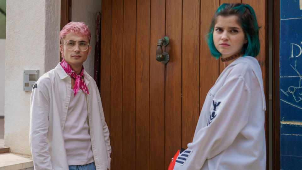 Carla Tous and Guillermo Lasheras stand together wearing moody faces in Through My Window: Across the Sea.