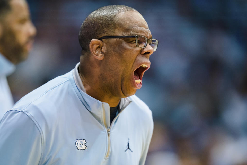 North Carolina coach Hubert Davis shouts during the first half of the team's NCAA college basketball game against Duke on Saturday, March 4, 2023, in Chapel Hill, N.C. (AP Photo/Jacob Kupferman)