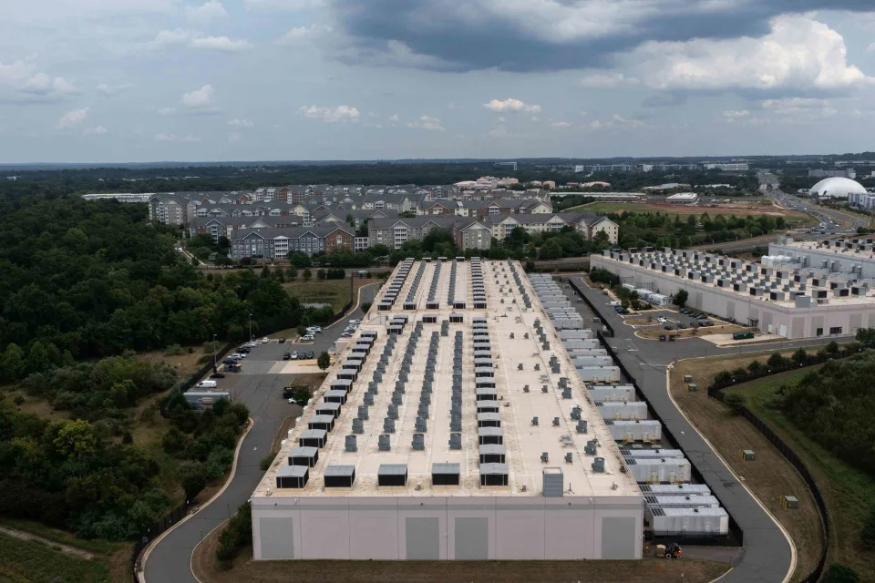 <p>Nathan Howard / Getty Images</p> An Amazon Web Services data center in Ashburn, Virginia