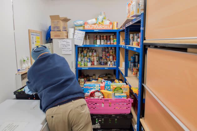 A foodbank volunteer stores donations at St John's Church before distributing them to local foodbanks in Stalybridge.