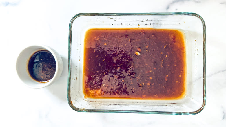 two containers with marinade