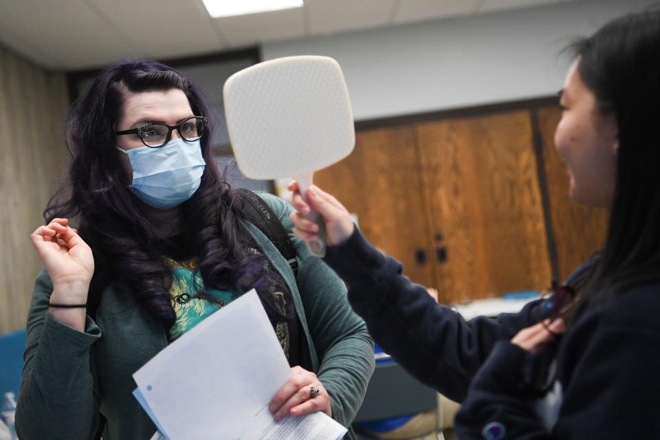 A patient picks out a pair of frames at Remote Area Medical’s pop-up clinic in Oak Ridge, Saturday Feb. 18, 2023.