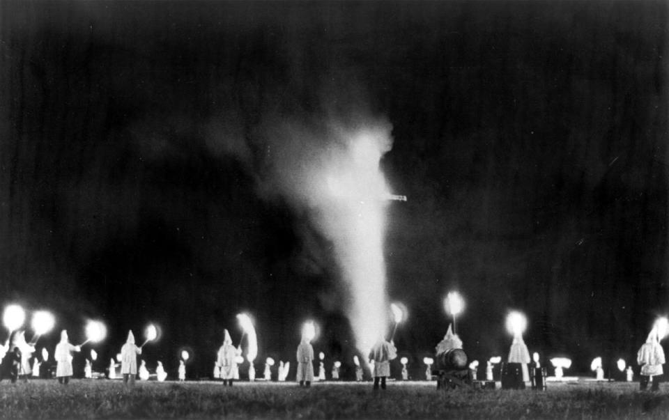 <p>A North Carolina Klan rally. The Ku Klux Klan, silent and almost unnoticed in North Carolina in recent years, has started a drive for money and members. This picture was made at a cross burning at Salisbury, N.C., Aug. 8, 1964. It was one of the first rallies scheduled in the KKK’s revival efforts in North Carolina. (Photo: AP) </p>