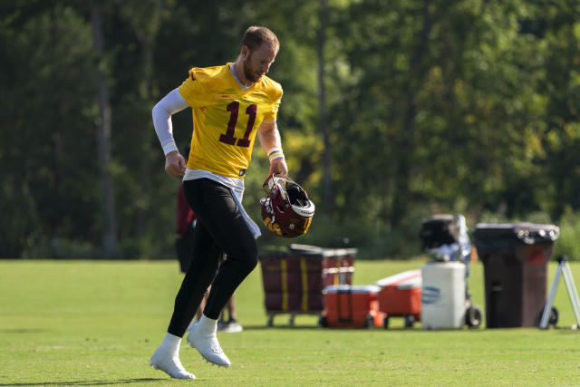 Washington Commanders quarterback Carson Wentz (11) in action during the  first half of a preseason NFL football game against the Carolina Panthers,  Saturday, Aug. 13, 2022, in Landover, Md. (AP Photo/Nick Wass