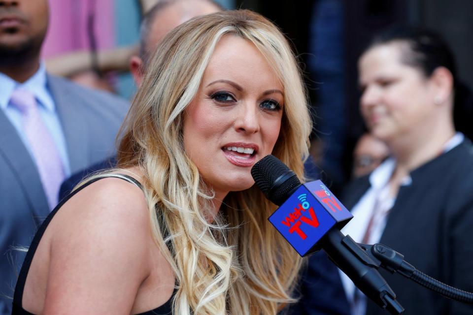 Stormy Daniels, who was paid hush money by Donald Trump’s attorney Michael Cohen under the former president’s direction, speaks to reporters in 2018. (REUTERS)