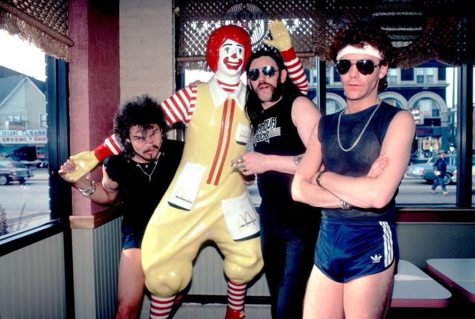 <p>Phil Taylor, Ian 'Lemmy' Kilmister, and Brian Robertson, better known as the British metal band Motorhead, at a McDonald's restaurant in Chicago. Just because.</p>