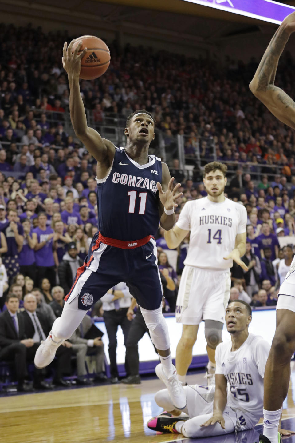 Gonzaga's Joel Ayayi (11) shoots against Washington in the first half of an NCAA college basketball game Sunday, Dec. 8, 2019, in Seattle. (AP Photo/Elaine Thompson)