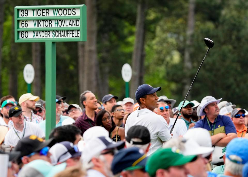 Tiger Woods follows his tee shot from on the first tee during the first round of the Masters.