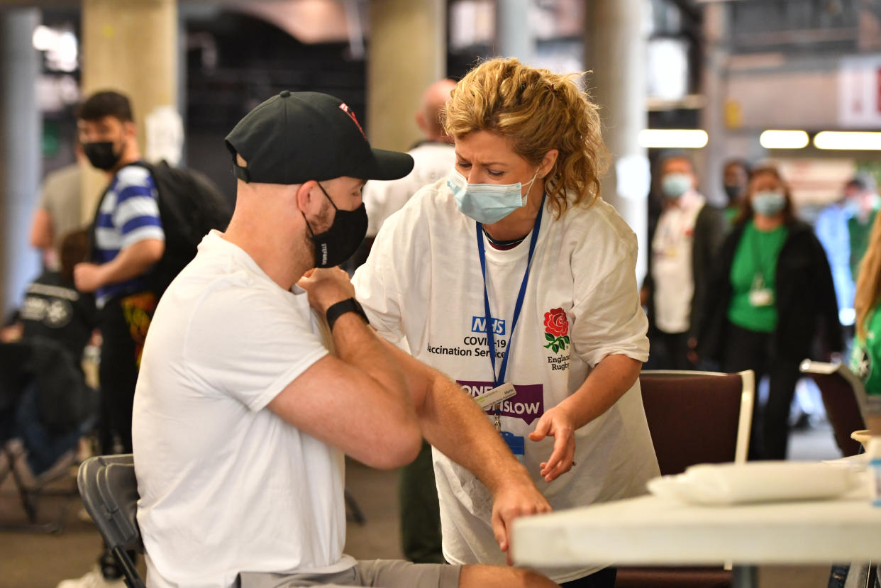 A member of the public prepares to receive a coronavirus vaccination at Twickenham rugby stadium, south-west London, where up to 15,000 doses are ready to be administered at the walk-in centre which has been set up for residents of north-west London in response to an increase in the number of cases of coronavirus in the area. Picture date: Monday May 31, 2021. (Photo by Dominic Lipinski/PA Images via Getty Images)