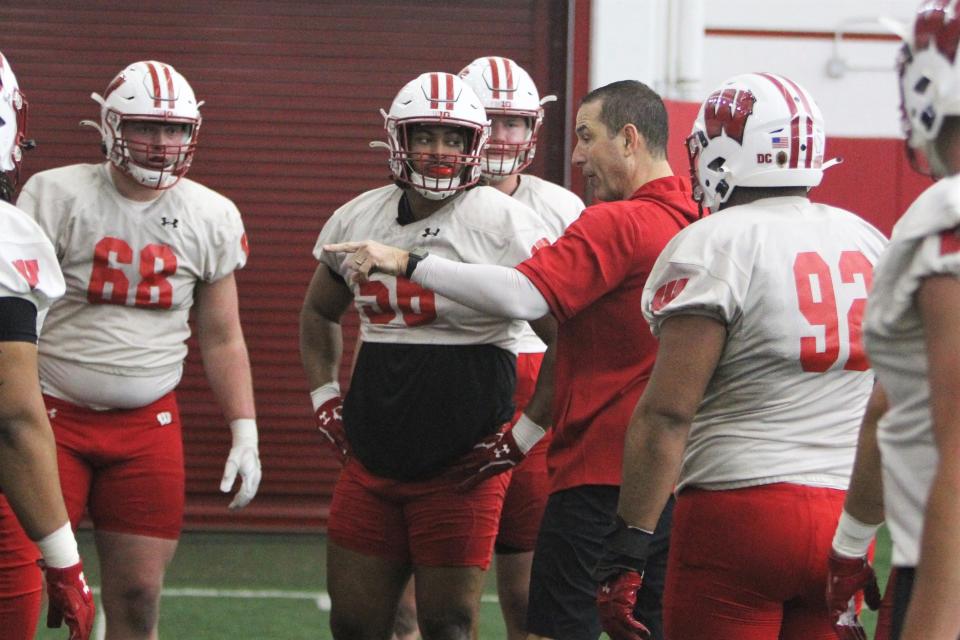 Wisconsin football coach Luke Fickell (center) makes a point to the defensive linemen during the team's first spring practice on Saturday March 25, 2023 at the McClain Center in Madison, Wis.
