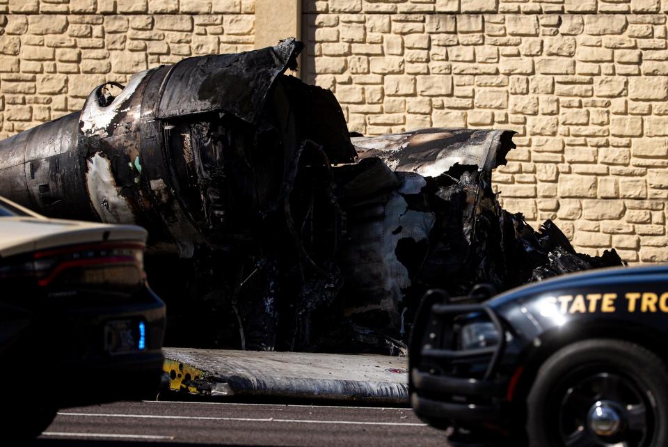 Emergency officials work the scene of a plane crash on I-75 in Naples near exit 105 on Saturday, Feb. 10, 2024. The plane carrying five people crashed on Friday, Feb. 9, 2023. Two people have been confirmed dead.