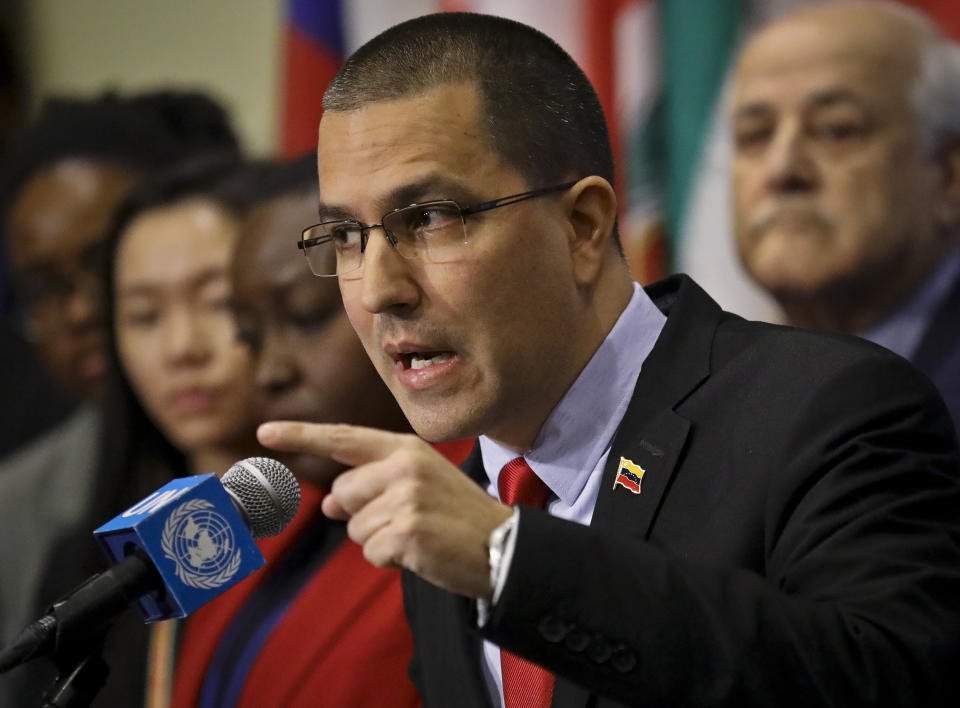 Venezuela Foreign Affairs Minister Jorge Arreaza speaks during a press conference surrounded by supporting diplomats from several countries including Russia, China, Iran and Syria, at U.N. headquarters, Thursday Feb. 14, 2019. (AP Photo/Bebeto Matthews)