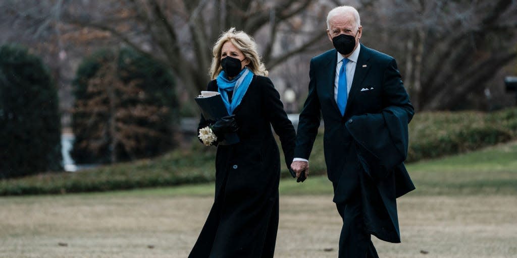 Joe Biden and Jill Biden wear matching blue accessories.