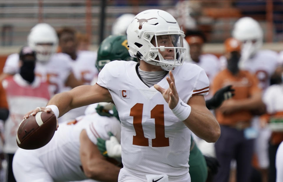 FILE - In this Oct. 24, 2020, file photo, Texas' Sam Ehlinger looks to pass against Baylor during the first half of an NCAA college football game in Austin, Texas. No. 15 Iowa State would reach the Big 12 championship game for the first time if can win at No. 20 Texas on Friday, Nov. 27, 2020. (AP Photo/Chuck Burton, File)