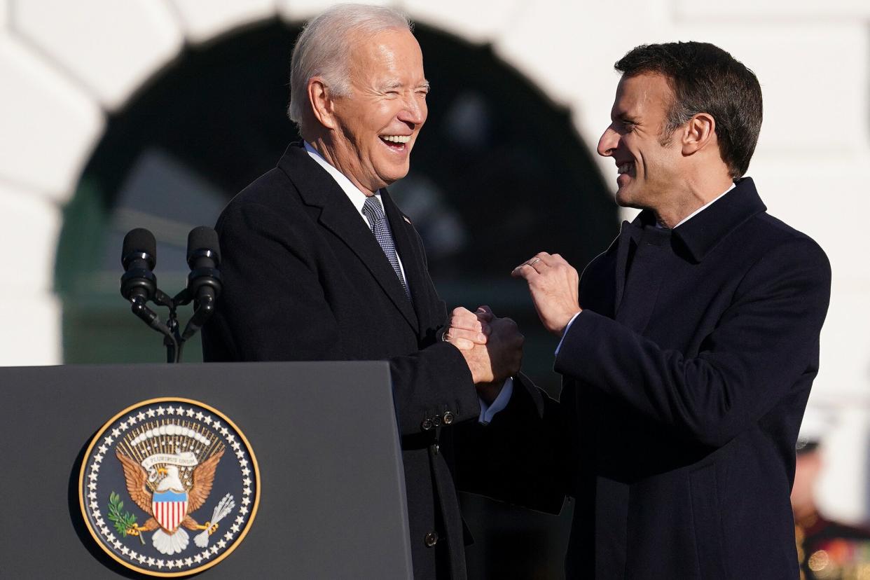 President Joe Biden and French President Emmanuel Macron wave as Biden welcomes Macron to the White House for an official state visit arrival ceremony on December 01, 2022 in Washington, DC. President Biden is welcoming Macron for the first official state visit of the Biden administration.