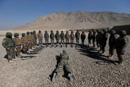 Female soldiers from the Afghan National Army (ANA) take part in a training exercise at the Kabul Military Training Centre (KMTC) in Kabul, Afghanistan October 26, 2016. REUTERS/Mohammad Ismail